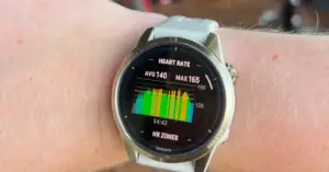 Female runner checking heart rate data after a training run