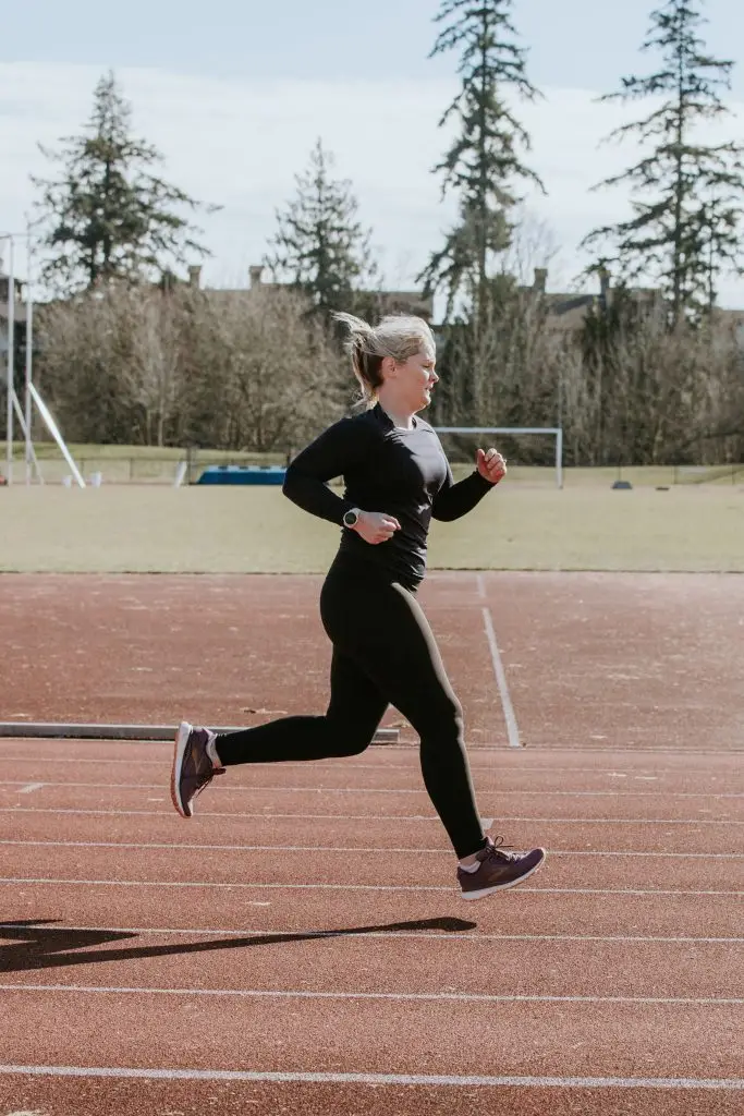 A runner on a track demonstrating heel striking technique