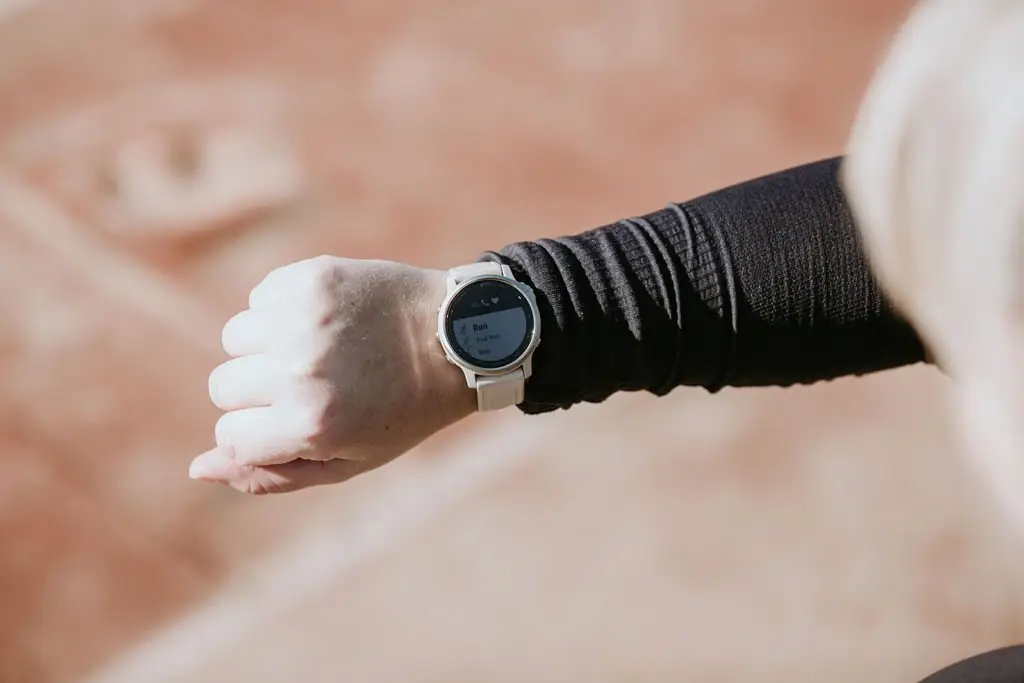 Image of a runner looking at their watch