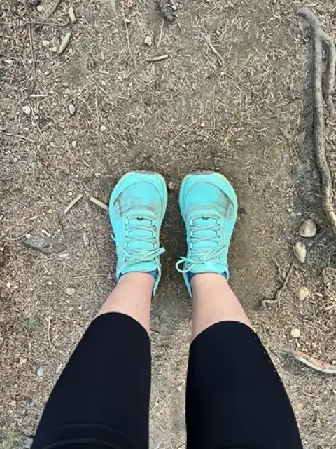 Runner choosing the best running shoes based on fit, support, and heel drop