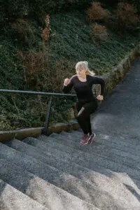 A runner running up a set of stairs