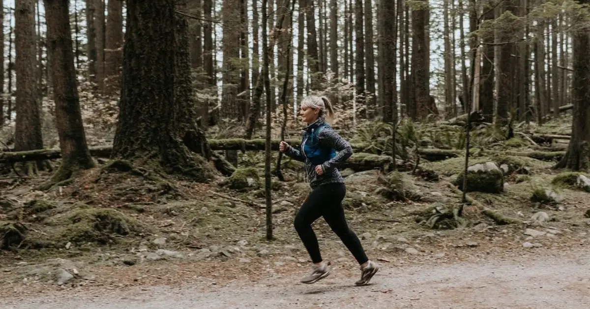 Female runner with knee osteoarthritis running on a trail
